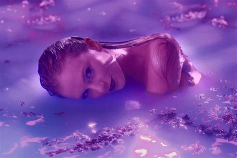 Taylor Swift Gets Sultry in Purple Pool for Lavender Haze Music Video