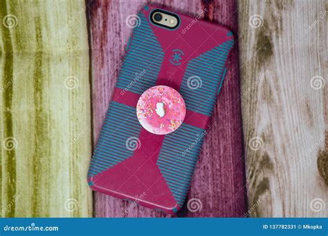 Back View of an IPhone Enclosed in a Case with a PopSocket Attached To ...