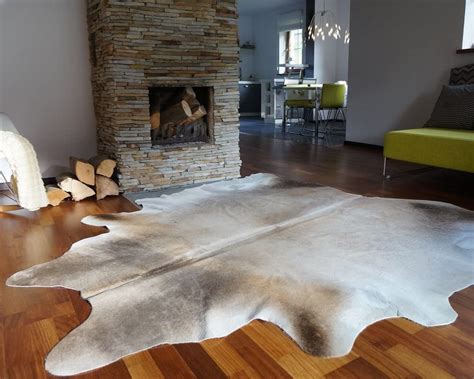 12 Cowhide Rug Ideas - Real, Tricolor, and Fake Cowhides [PHOTOS]