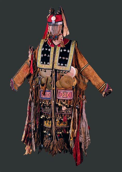 an elaborately decorated costume is displayed on a black background in ...