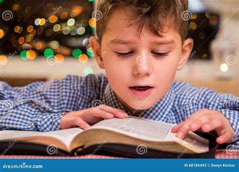 Kid reading book out loud. stock image. Image of fairytale - 68785493