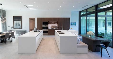 An L-Shaped Kitchen Island Is A Creative Way To Include Seating And A Table