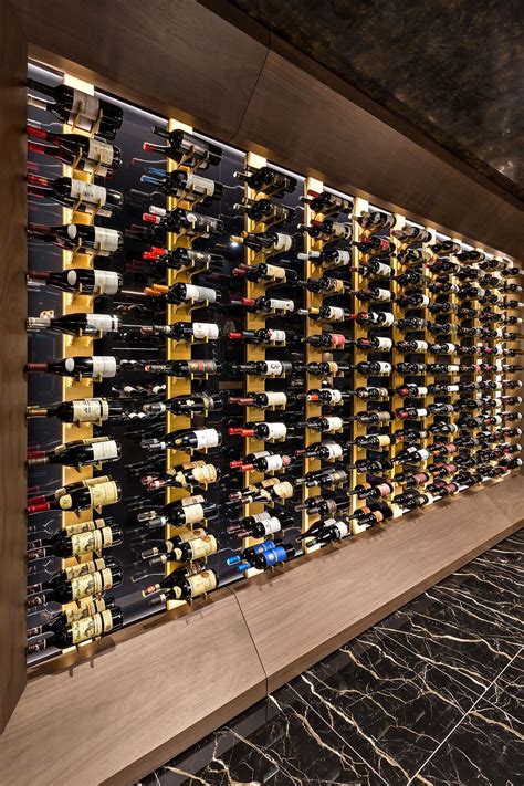 Wine Wall with Gold Aluminum Wine Racks and custom Lighting | Wine wall ...