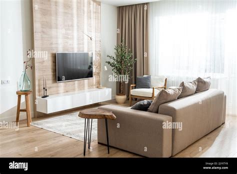 Sofa in the living room in a modern apartment with a convenient location Stock Photo - Alamy