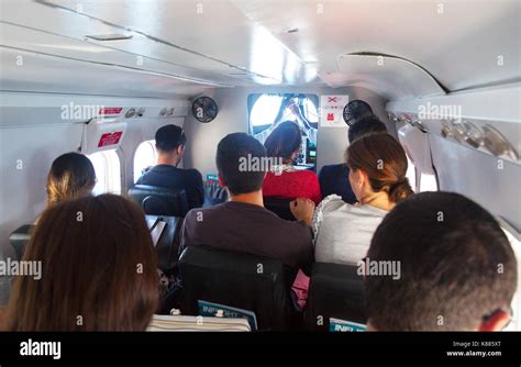 Air passengers flying in the interior of a DHC-6 Twin Otter 300/400 ...