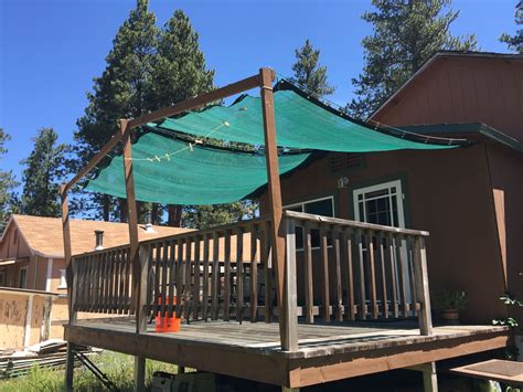 One of or cherished Tarps Plus customers using their green mesh tarps for deck patio shade. # ...