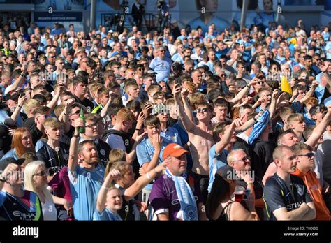 Manchester City fans celebrate at the Etihad Stadium, Manchester Stock ...