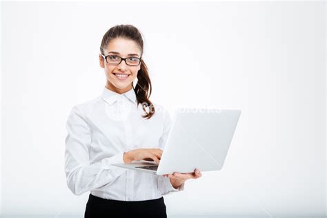 Smiling professional woman with laptop over white background Royalty-Free Stock Image - Storyblocks