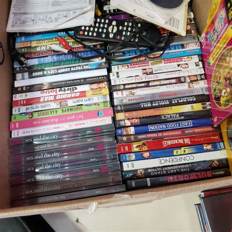 BOX OF DVDS AND DVD PLAYER - Big Valley Auction