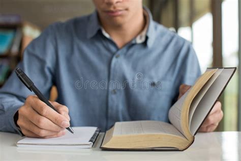 Business Man Reading a Book and Writing Notes on Table Stock Photo - Image of professional, hand ...