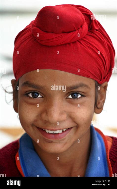 Punjabi Sikh kid child boy wearing red turban in Amritsar , India Stock ...