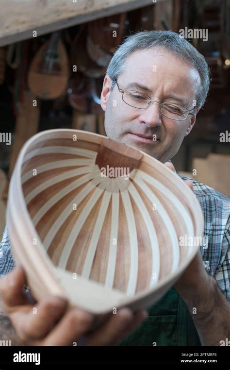 Craftsman manufacturing lute at workshop Stock Photo - Alamy