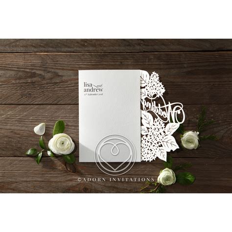 Laser Cut Floral Invitation With "Wedding" in the Details