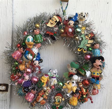 Disney wreath made with vintage Disney ornaments , fun for the holidays ...