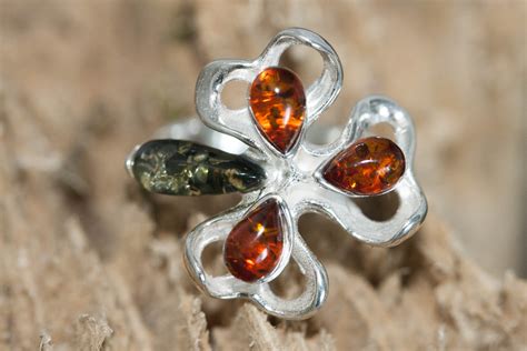 Flower amber ring. Baltic amber ring. Two different shades of Baltic amber in sterling silver ...