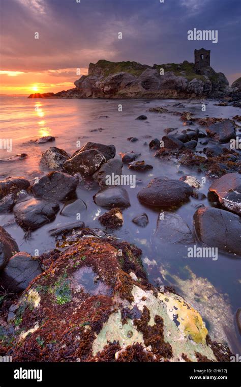 Spectacular sunrise at Kinbane Head with the ruins of Kinbane Castle on the Causeway Coast in ...