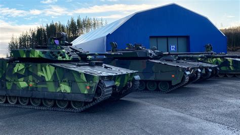 CV90 IFV in action on the test range and presentation of the current Swedish defence policy ...