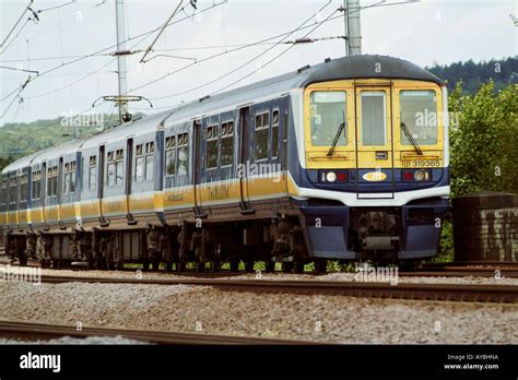 Thameslink class 319 train travelling through the british countryside on the midland mainline ...