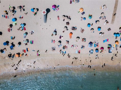 Drone View Of People At Beach stock photo