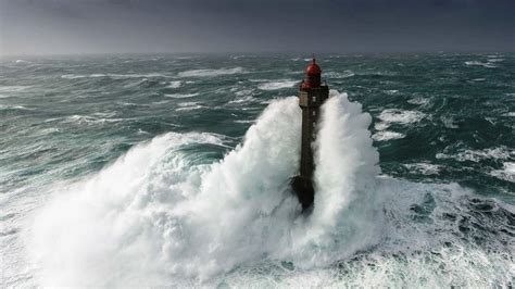 The Lighthouse of La Jument during storm - backiee