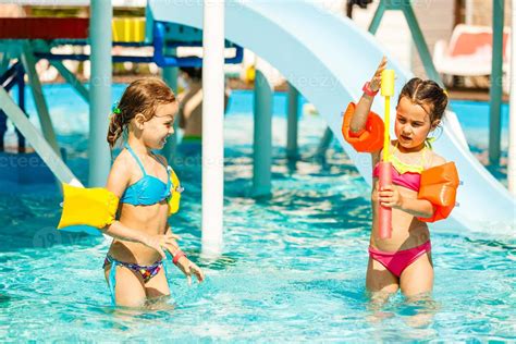 two little kids playing in the swimming pool 16478522 Stock Photo at ...