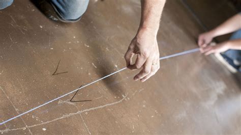 Using a Chalk Line | How to Use a Chalk Line to Mark a Straight Line | DIY Doctor