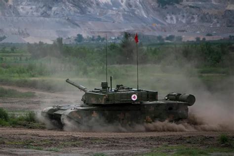 Type 99A tanks conduct live-fire training at night