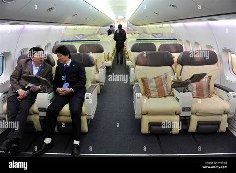 Visitors are pictured in a full-scale model of the C919 jet plane of COMAC (Commercial Aircraft ...