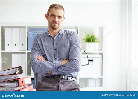 Man sitting on desk stock photo. Image of male, professional - 63199372