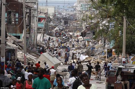 Haiti earthquake in pictures: Shell-shocked survivors roam streets scavenging for scraps | Daily ...