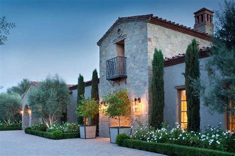 Northern Italian style villa surrounded by an inviting desert oasis