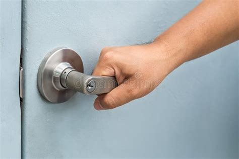 Man hand opening door knob stock image. Image of knob - 96786437