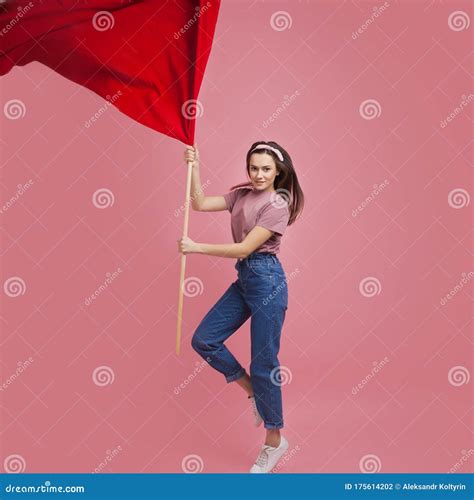 Young and Beautiful Girl with a Red Flag on a Pink Background. a Socially Active Woman, To ...