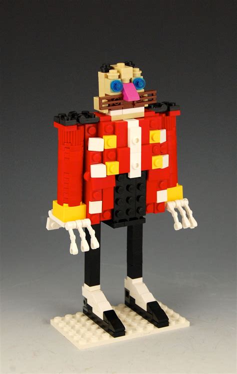 a lego figurine is dressed in red and yellow