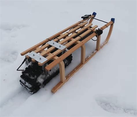 Never Walk Uphill Again With This Motorized Sled