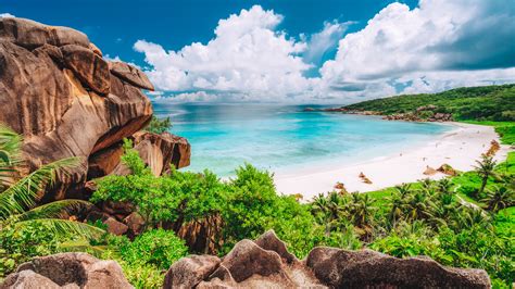 Panorama view of tropical beach Grande Anse on La Digue Island ...