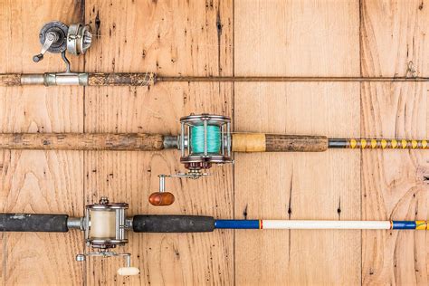 "Vintage And Antique Fishing Rods" by Stocksy Contributor "SKC" - Stocksy