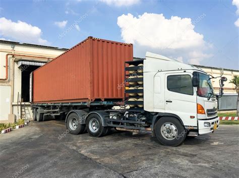 Container truck loading goods at warehouse — Stock Photo © vittavat-a #95857850