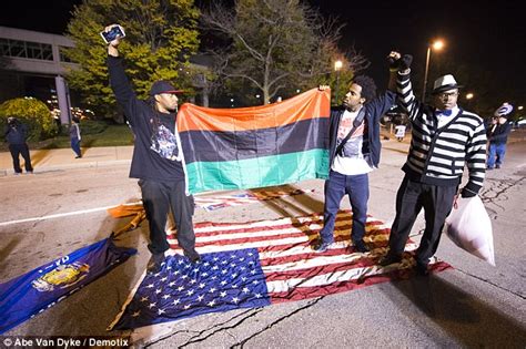 Black Lives Matter Protester Burns American Flag Outside Of GOP Debate In Milwaukee