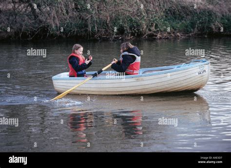 Two girls rowing boat in hi-res stock photography and images - Alamy