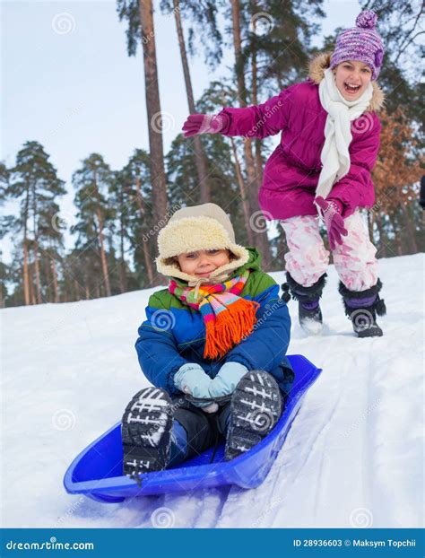 Children On Sleds In Snow Stock Photos - Image: 28936603