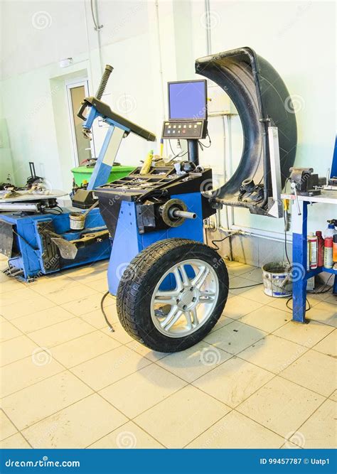 Tyre fitting equipment stock image. Image of fitting - 99457787