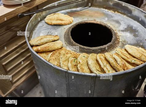 The making bread in tandoor oven Stock Photo - Alamy