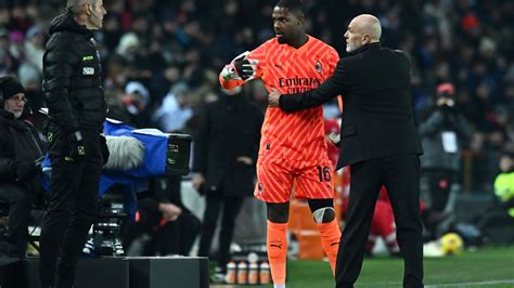 Mike Maignan and AC Milan stars walk off the pitch following racial abuse from stands in Udinese ...