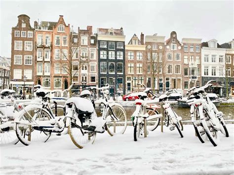 Snow and frozen canals in Amsterdam - Winter 2021 | Velvet Escape