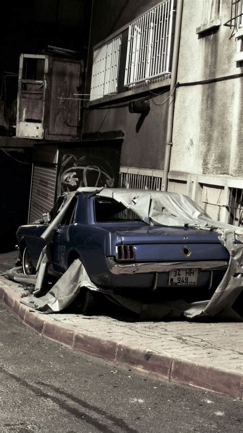 Download Unexpectedly Parking: A Crashed Car on a Building Wallpaper ...