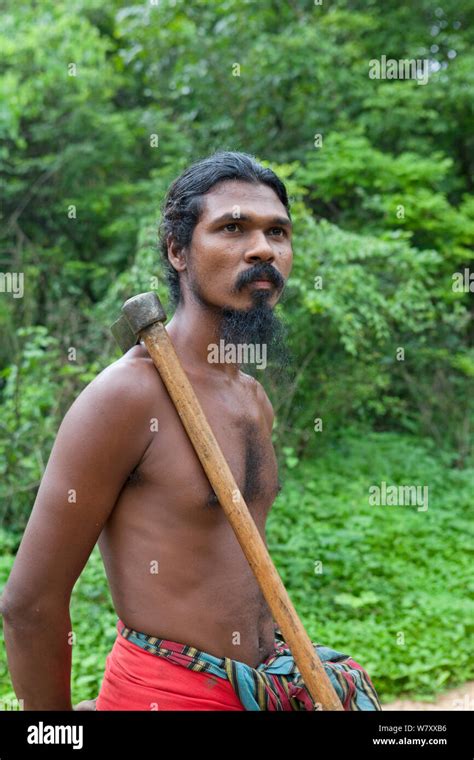 Portrait of Vedda tribesman carrying axe, Dambana, Sri Lanka, December ...