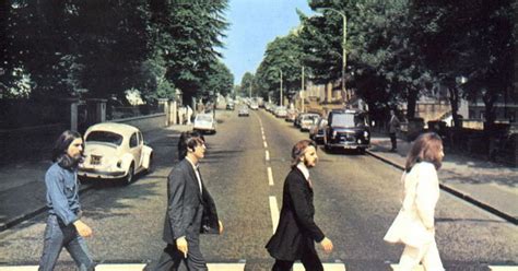 Abbey Road zebra crossing made famous by The Beatles is dug up to disappointment of fans ...