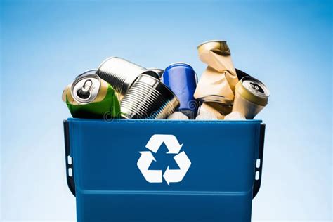 Various Metal Cans in Trash Bin with Recycle Sign Stock Photo - Image ...