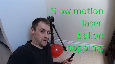 Slow motion balloon popping with cheap ebay burning laser pointer. - YouTube